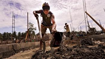 Volunteer build shoveling in the Phillppines