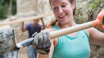 Habitat for Humanity volunteer shovel El Salvador young professional