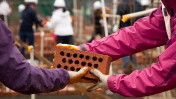 Volunteers laying bricks, pay it foward, Habitat for Humanity