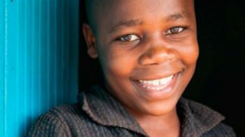 a boy from Kenya smiling