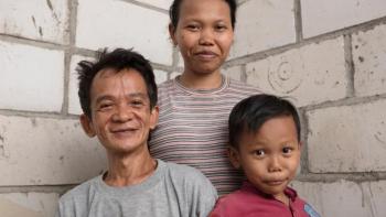 Abdul with his wife Warkatul and son Arman in their home in Tegal Sari, Indonesia.