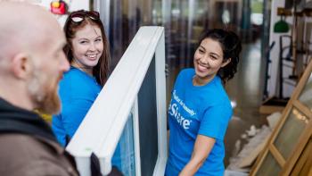 A customer donates goods to Habitat ReStore