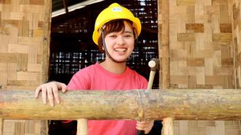 Habitat volunteer builds with bamboo during Young Leaders Build in Myanmar