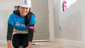 Habitat volunteers help future homeowners build houses.