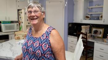 Sara stands in her Habitat home. 