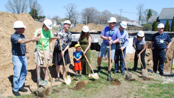 Group of volunteers at groundbreaking.