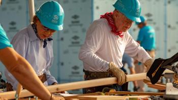 President and Mrs. Carter on the build site.