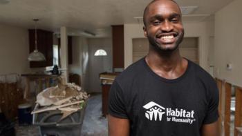 Harvey cleanup house with smiling volunteer