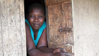 Photo: a woman looking out of the window