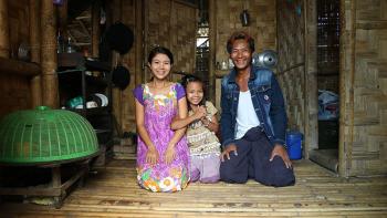 (From left) Bok Bok with her daughter Shwe Yati and husband Pyae Phyo in their Habitat home in Myanmar. They live under one roof with Bok Bok's mother and other family members.