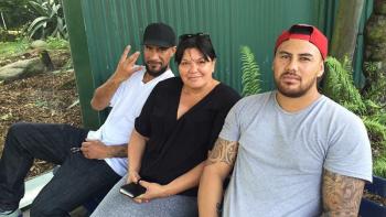 Habitat homeowner Mihi, with her sons, outside her home in New Zealand.