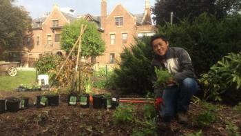 Steven Yang smiling in his garden.