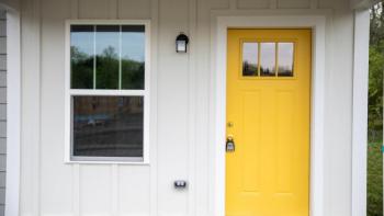 House with yellow door.