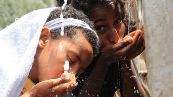 Photo: Children drinking water from a water point in Ethiopia