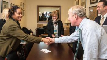 Two colleagues shaking hands.