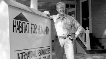 Former U.S. President Jimmy Carter with Habitat sign.