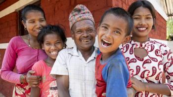 The Danuwar family of five, pictured smiling here, partnered with Habitat for Humanity Nepal to rebuild the home they lost during the 2015 Nepal earthquake. 