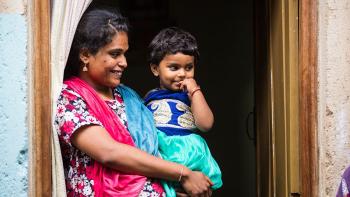 Indian woman with child. Photo from Habitat India's Facebook page.