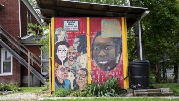 Photo of a colorful mural depicting diverse residents of a community.