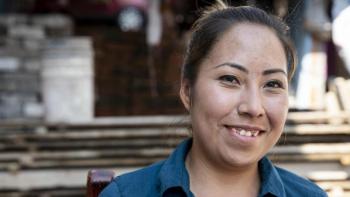 Young Mexican woman smiling.