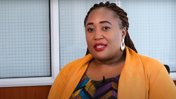 A woman in a yellow cardigan during an interview about the ShelterTech Africa launch.