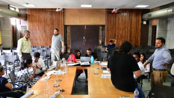 A group of business professionals at a round table.