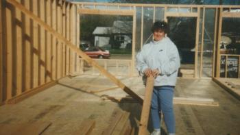 Cathy on the build site of her home in 1995.