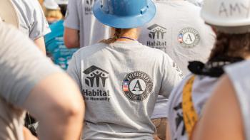 AmeriCorps member standing in a group.
