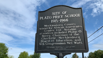 Historical marker with information on the Plato Price School.