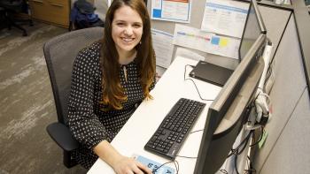 Woman at her desk.