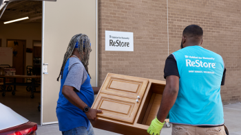 Volunteers unload donations at the Habitat ReStore donation drop-off.