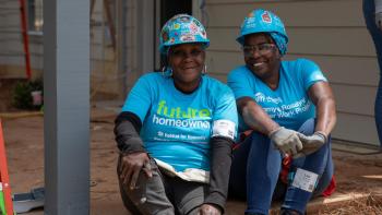 Future homeowner and volunteer taking a break during Carter Work Project 2026.