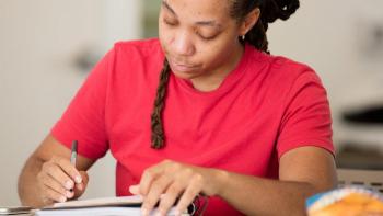 Person in red shirt applying for a Habitat house