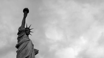 Black and white photo of the Statue of Liberty. 