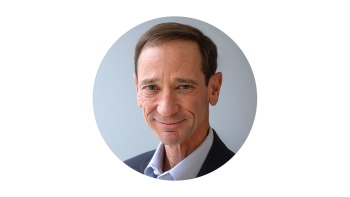 Headshot of Craig Molyneaux in a suit