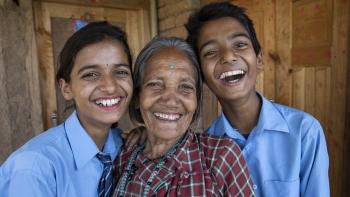 Grandmother with her twin grandchildren in Nepal.