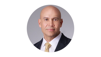 Headshot of Tim Phillips in a suit
