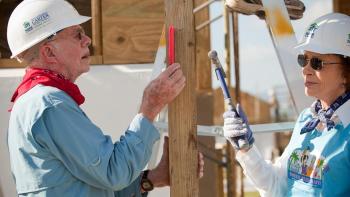 Jimmy and Rosalynn Carter working on a build site during Carter Work Project.