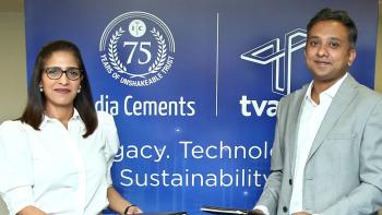 A man and woman in business clothes pose