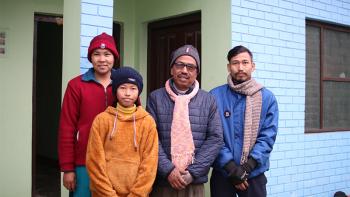 Mohan (third from left) and family at their house in Dhangadhi, Nepal