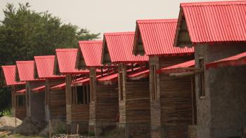 Line of cement bamboo frame homes with red roofs