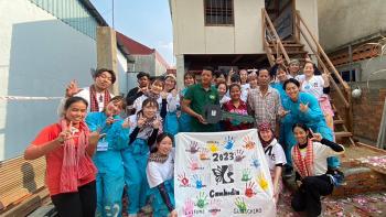 Japanese volunteers with future homeowners on a build in Cambodia