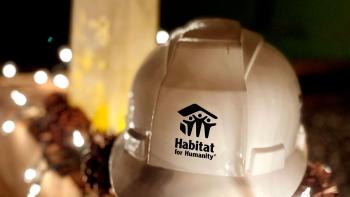 Habitat hardhat surrounded by soft white string lights