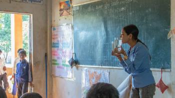 Teacher in a classroom teaching students