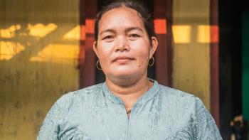 A portrait of Komariyah (38) in front of her rental home in Tanjung Kait, Banten, Indonesia.