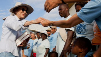 Rosalynn Carter shaking hands with volunteers.