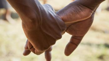 A closeup of two hands.