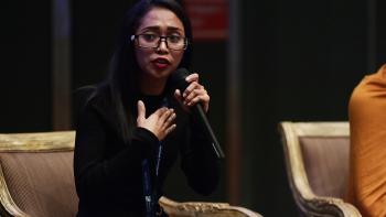 Mardee speaking at an event.