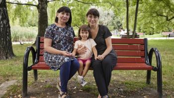 Ukrainian women sitting in the park in Warsaw