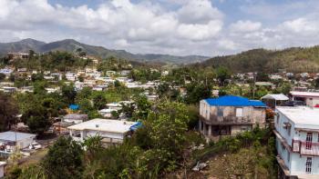 Landscape photograph of Puerto Rico neighborhood with mountains in distance